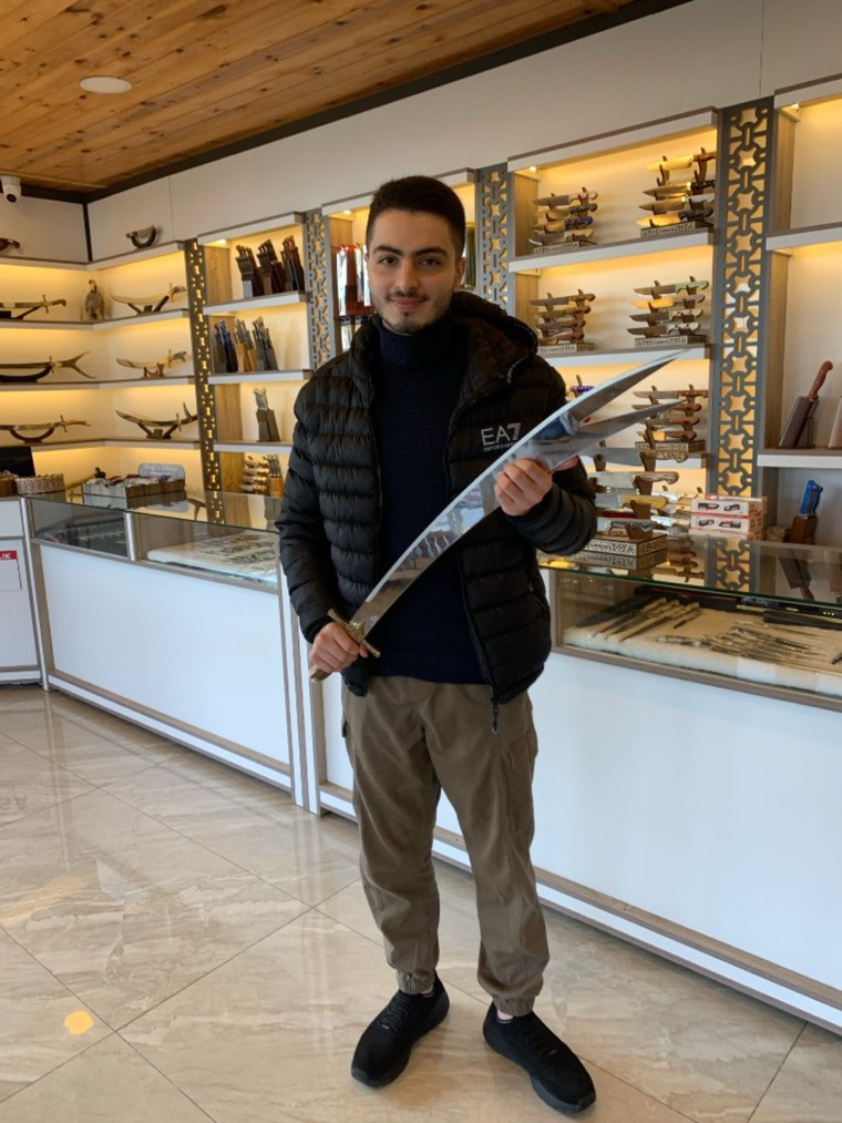 Zaid holding a sword